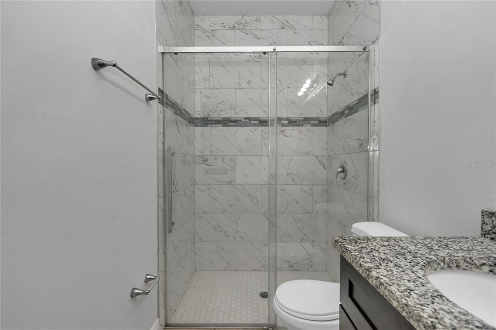 3650 Southwest 128th Place Ocala, FL 34473 - Photo 29 of 40 a bathroom with a sink toilet and shower