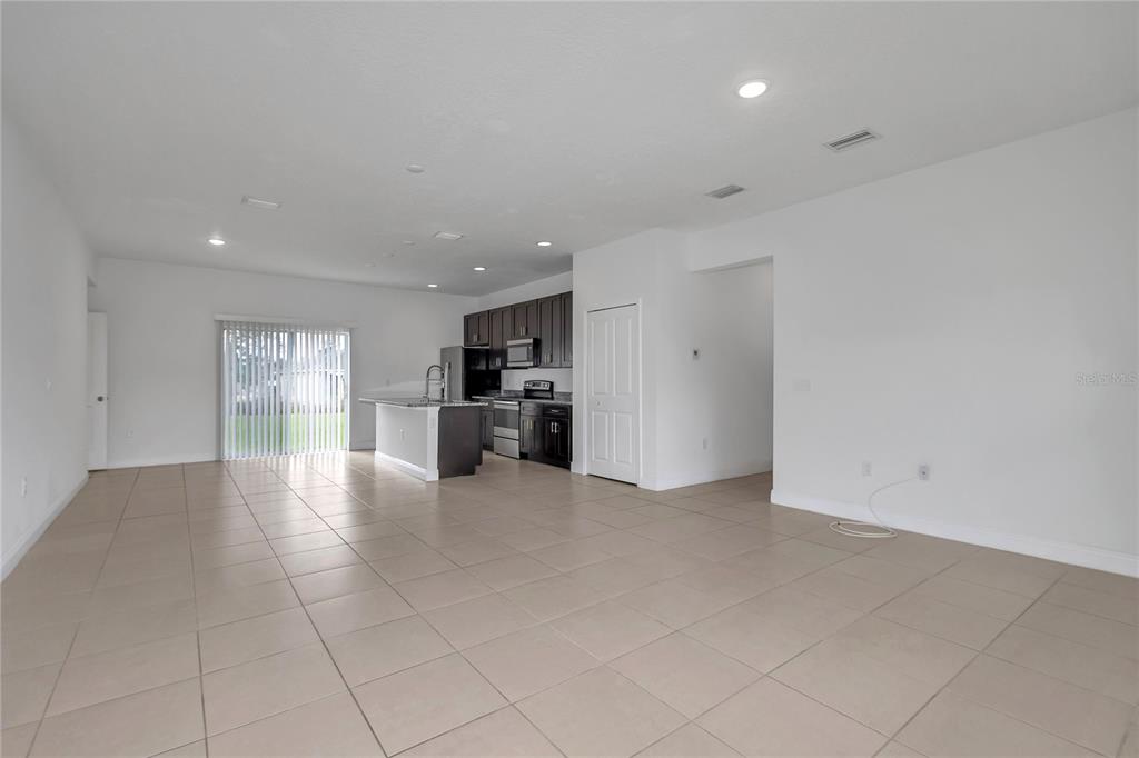 3650 Southwest 128th Place Ocala, FL 34473 - Photo 3 of 40 a view of empty room with kitchen and window