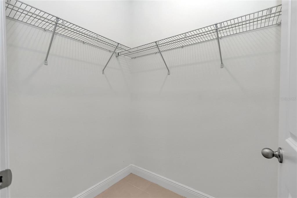 3650 Southwest 128th Place Ocala, FL 34473 - Photo 31 of 40 a view of a room with racks on the wall