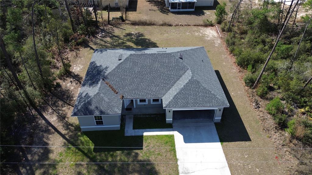 3650 Southwest 128th Place Ocala, FL 34473 - Photo 38 of 40 an aerial view of a house with a yard