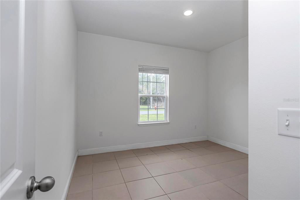 3650 Southwest 128th Place Ocala, FL 34473 - Photo 6 of 40 a view of an empty room with a window