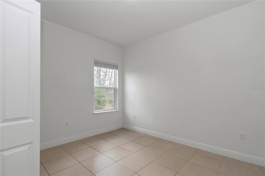 3650 Southwest 128th Place Ocala, FL 34473 - Photo 9 of 40 an empty room with windows