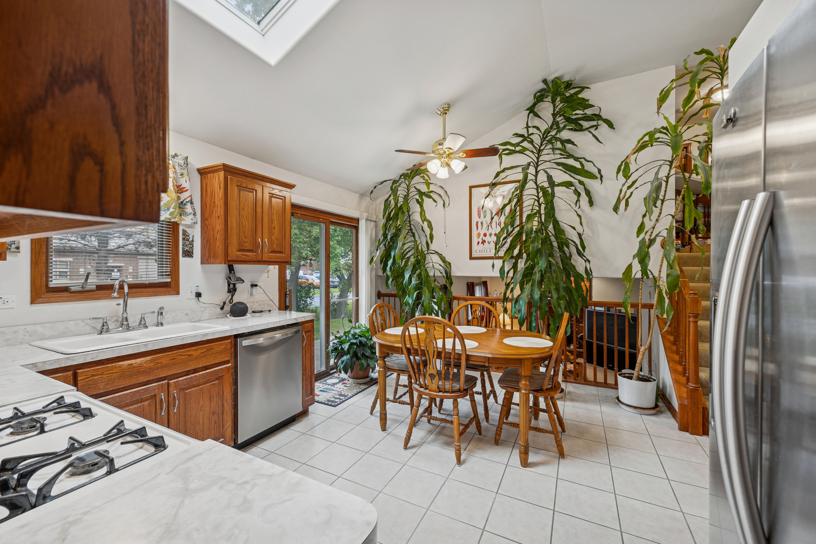 5524 Christopher Drive Oak Forest, IL 60452 - Photo 12 of 20 a kitchen with stainless steel appliances granite countertop a sink and a refrigerator