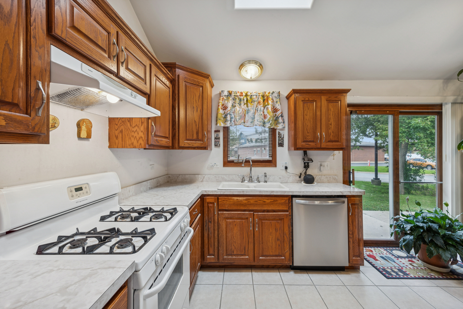 5524 Christopher Drive Oak Forest, IL 60452 - Photo 14 of 20 a kitchen with a sink stove and cabinets