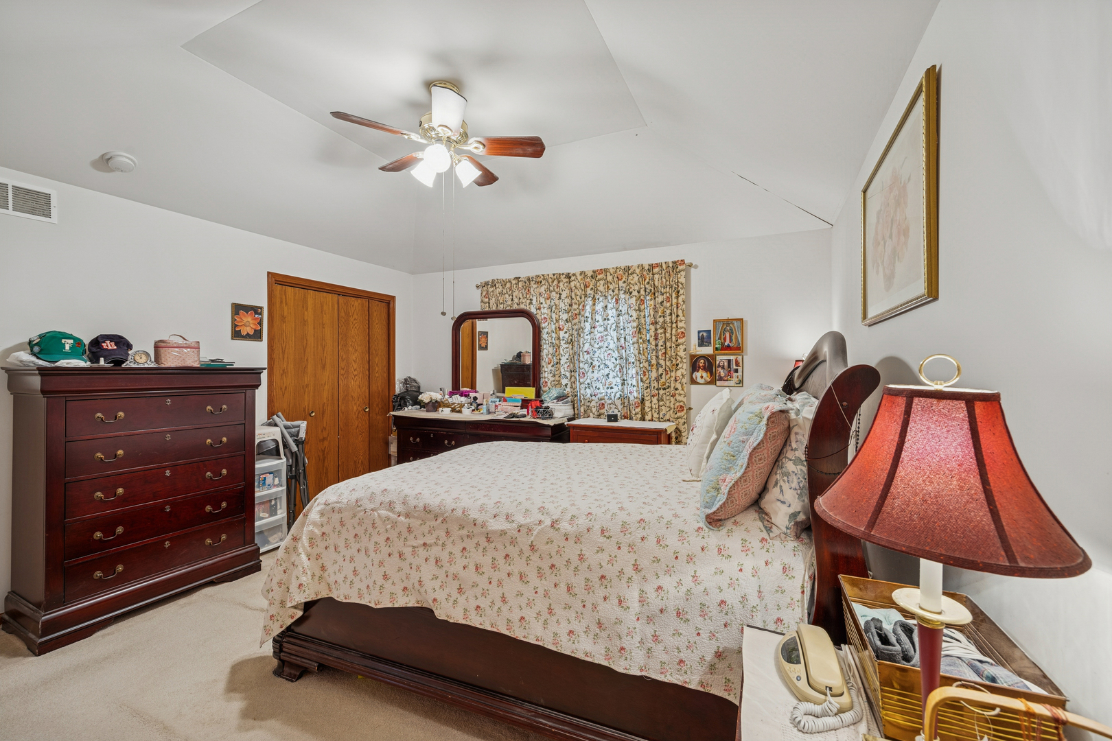 5524 Christopher Drive Oak Forest, IL 60452 - Photo 17 of 20 a bedroom with a bed and dresser with mirror