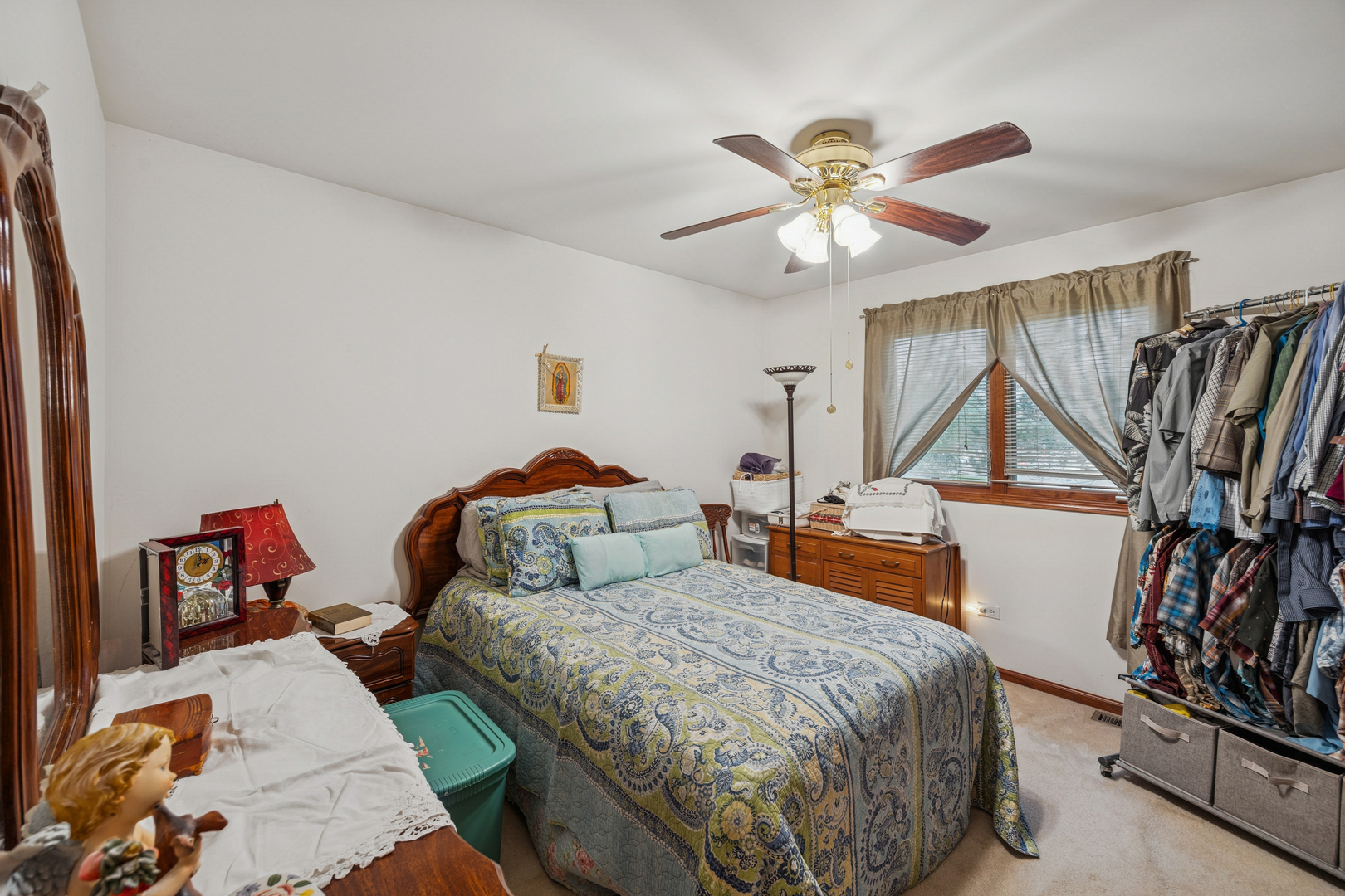 5524 Christopher Drive Oak Forest, IL 60452 - Photo 19 of 20 a bedroom with a bed and a chandelier