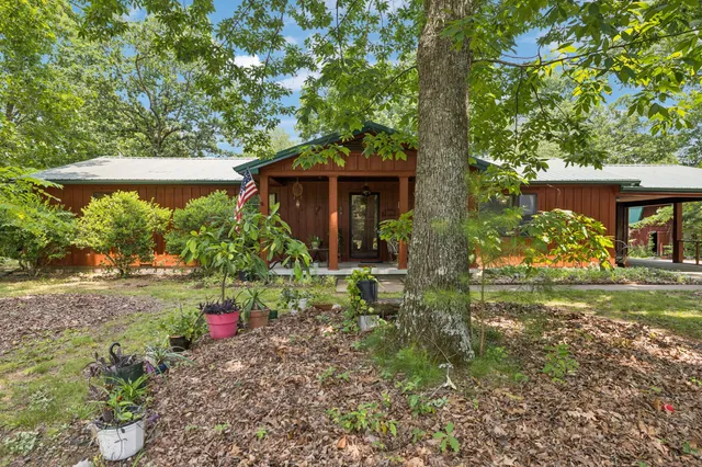 a backyard of a house with lots of green space
