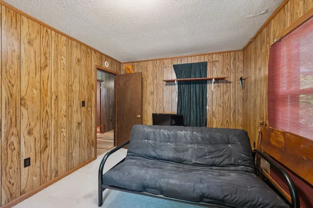 a living room with a couch and a shower