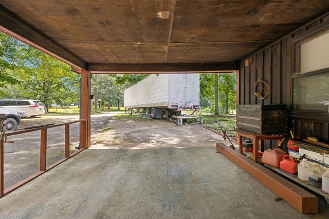 a backyard of a house with yard and outdoor seating