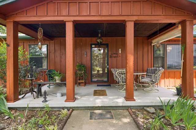 a view of living room with furniture and floor to ceiling window