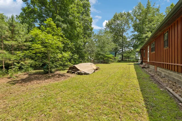 a backyard of a house with lots of green space