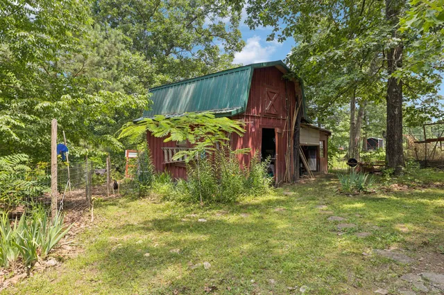 a view of a swimming pool with an outdoor seating area