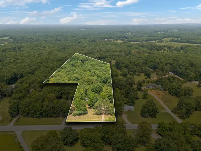 a view of a field with an outdoor space
