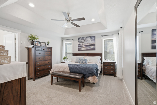 638 Canyon Rim Road Smithfield, UT 84335 - Photo 14 of 56 Bedroom featuring light carpet, recessed lighting, a raised ceiling, and ceiling fan
