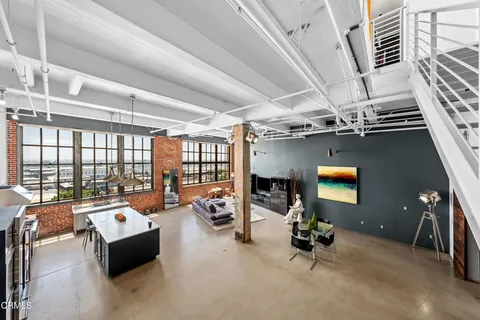 a room with gym equipment and a large window