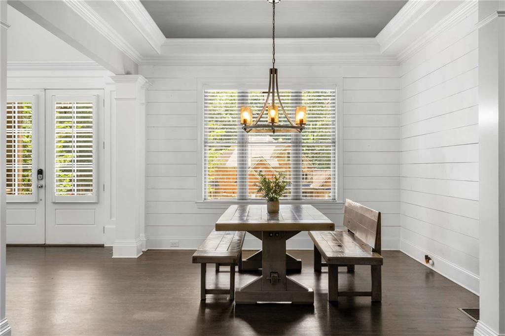 5055 Pointer Ridge Flowery Branch, GA 30542 - Photo 13 of 79 a view of a dining room with furniture window and wooden floor