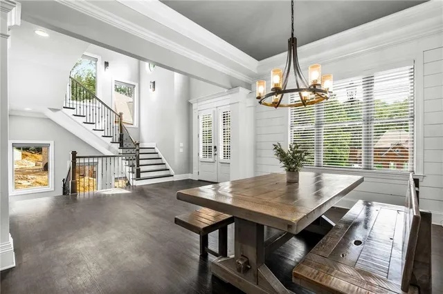 a spacious bedroom with a bed and a flat screen tv