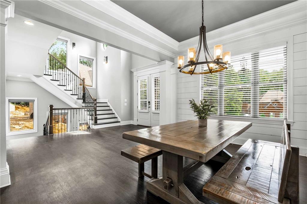 5055 Pointer Ridge Flowery Branch, GA 30542 - Photo 14 of 79 a view of a dining room with furniture wooden floor and chandelier