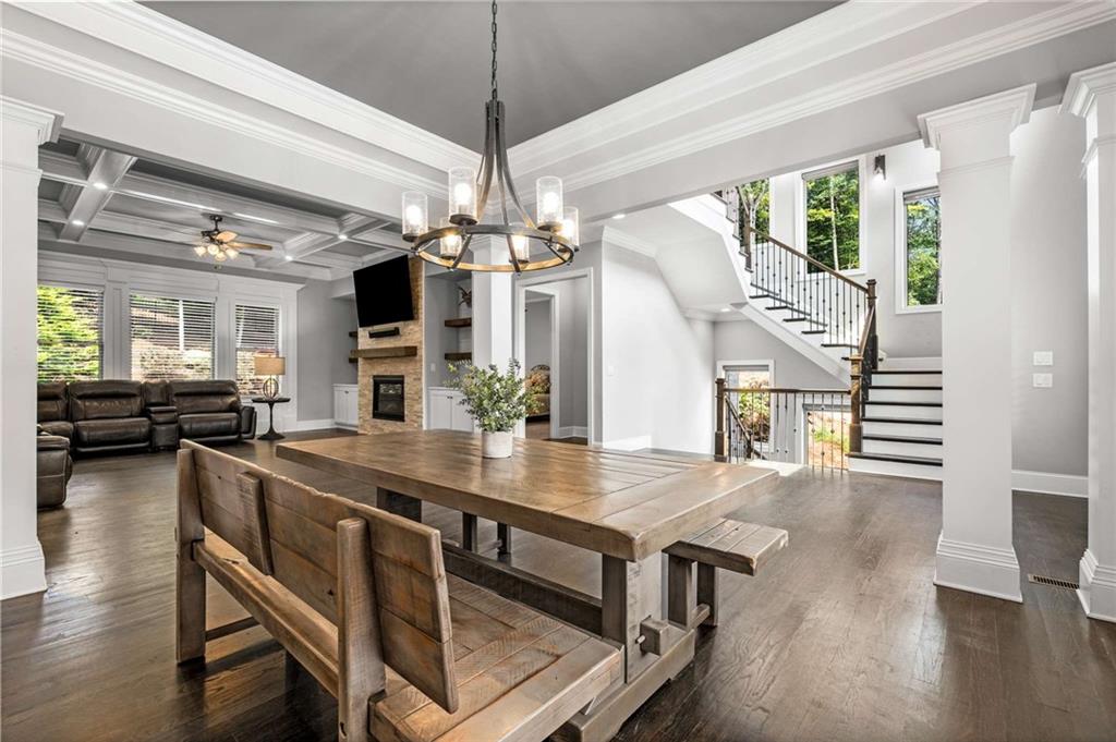 5055 Pointer Ridge Flowery Branch, GA 30542 - Photo 15 of 79 a view of a dining room with furniture window and wooden floor