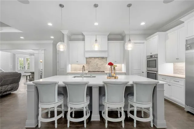 a large bathroom with a large tub and sink