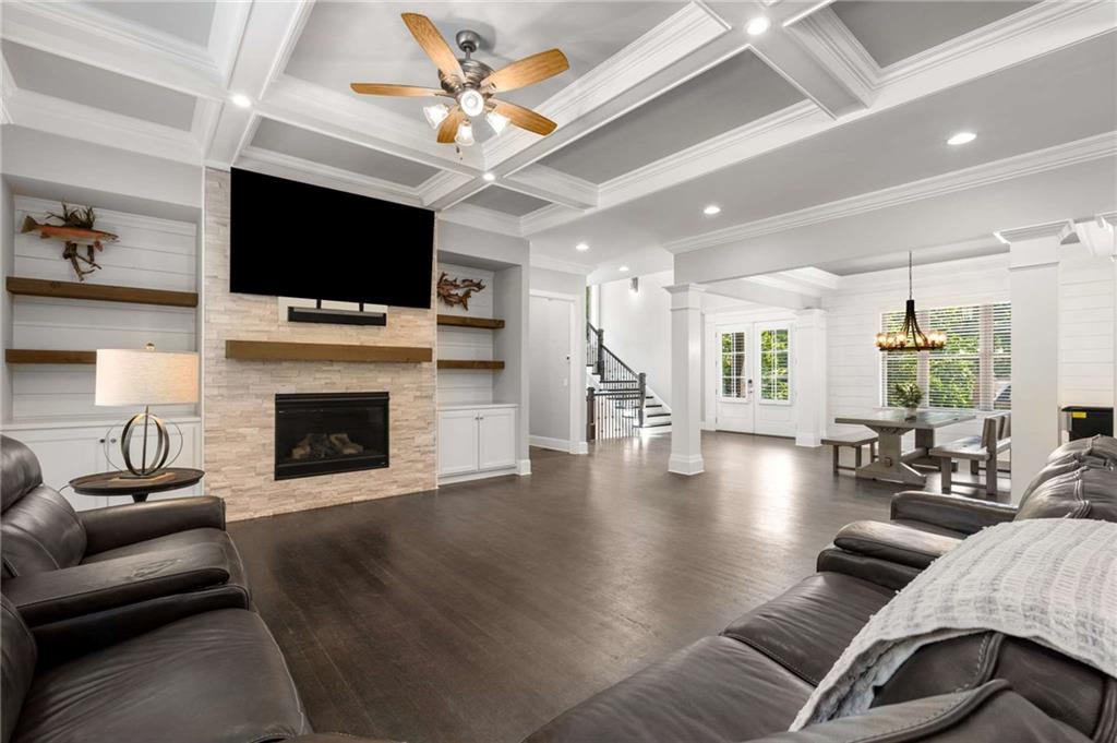 5055 Pointer Ridge Flowery Branch, GA 30542 - Photo 25 of 79 a living room with furniture fireplace and a flat screen tv