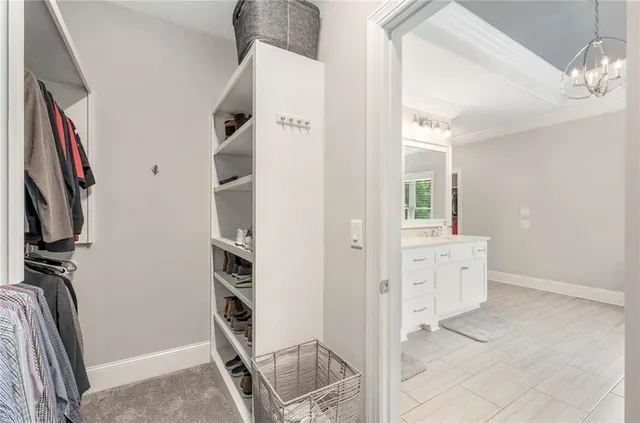 a patio with a table and chairs under an umbrella