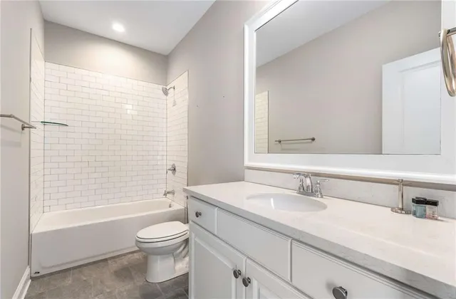 a view of a house with a yard and pathway