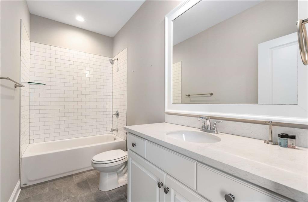 5055 Pointer Ridge Flowery Branch, GA 30542 - Photo 40 of 79 a bathroom with a sink toilet and shower