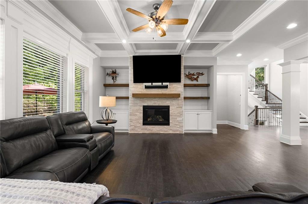 5055 Pointer Ridge Flowery Branch, GA 30542 - Photo 4 of 79 a living room with furniture fireplace and flat screen tv