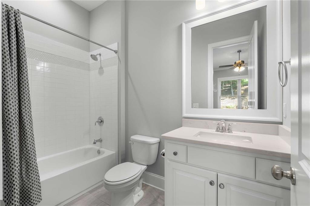 5055 Pointer Ridge Flowery Branch, GA 30542 - Photo 43 of 86 a bathroom with a sink toilet and shower
