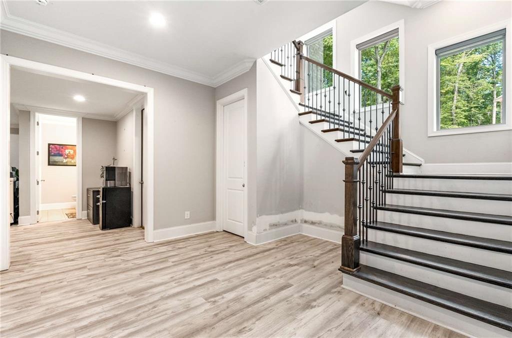 5055 Pointer Ridge Flowery Branch, GA 30542 - Photo 45 of 79 a view of entryway and hall with wooden floor