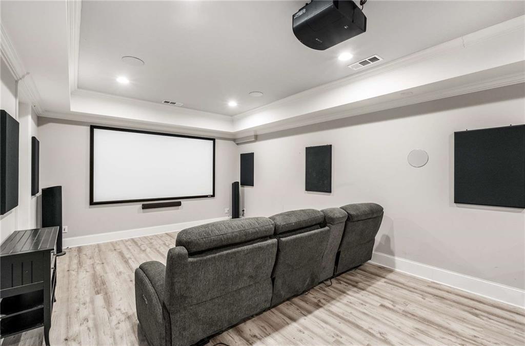 5055 Pointer Ridge Flowery Branch, GA 30542 - Photo 47 of 79 a living room with furniture and a flat screen tv
