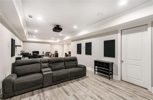 an aerial view of residential houses with outdoor space and trees