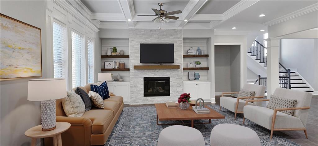 5055 Pointer Ridge Flowery Branch, GA 30542 - Photo 6 of 86 a living room with furniture a flat screen tv and a fireplace