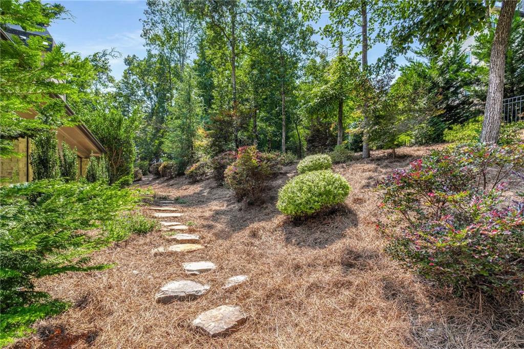 5055 Pointer Ridge Flowery Branch, GA 30542 - Photo 65 of 86 a backyard of a house with outdoor seating