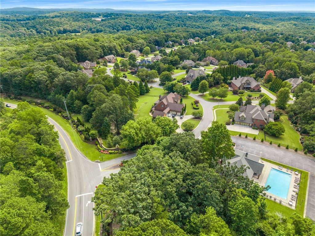 5055 Pointer Ridge Flowery Branch, GA 30542 - Photo 77 of 79 an aerial view of residential houses with outdoor space and trees