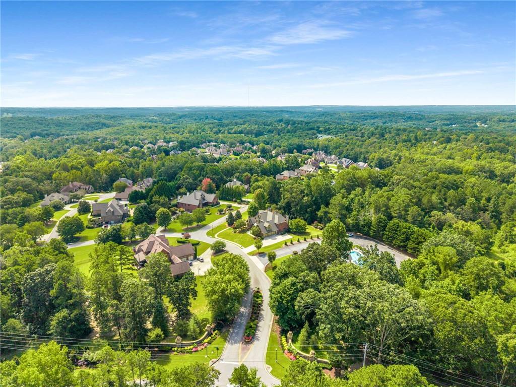 5055 Pointer Ridge Flowery Branch, GA 30542 - Photo 79 of 79 an aerial view of residential houses with outdoor space and trees