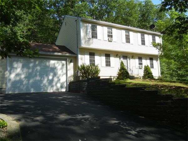 42 Clark Road Sturbridge, MA 01518 - Photo 1 of 19 a front view of a house with garden