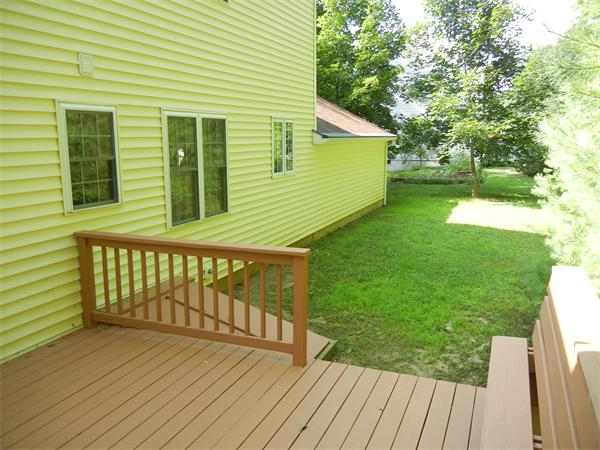 42 Clark Road Sturbridge, MA 01518 - Photo 3 of 19 a balcony with wooden floor and fence