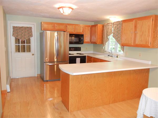 42 Clark Road Sturbridge, MA 01518 - Photo 6 of 19 a kitchen with stainless steel appliances a refrigerator and a sink