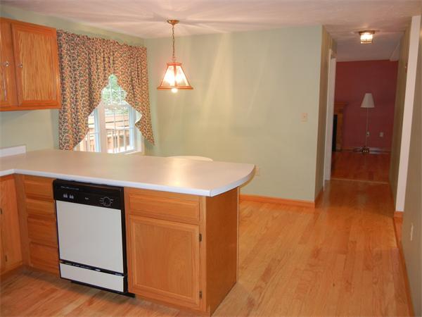 42 Clark Road Sturbridge, MA 01518 - Photo 9 of 19 a kitchen with kitchen island a sink appliances and cabinets