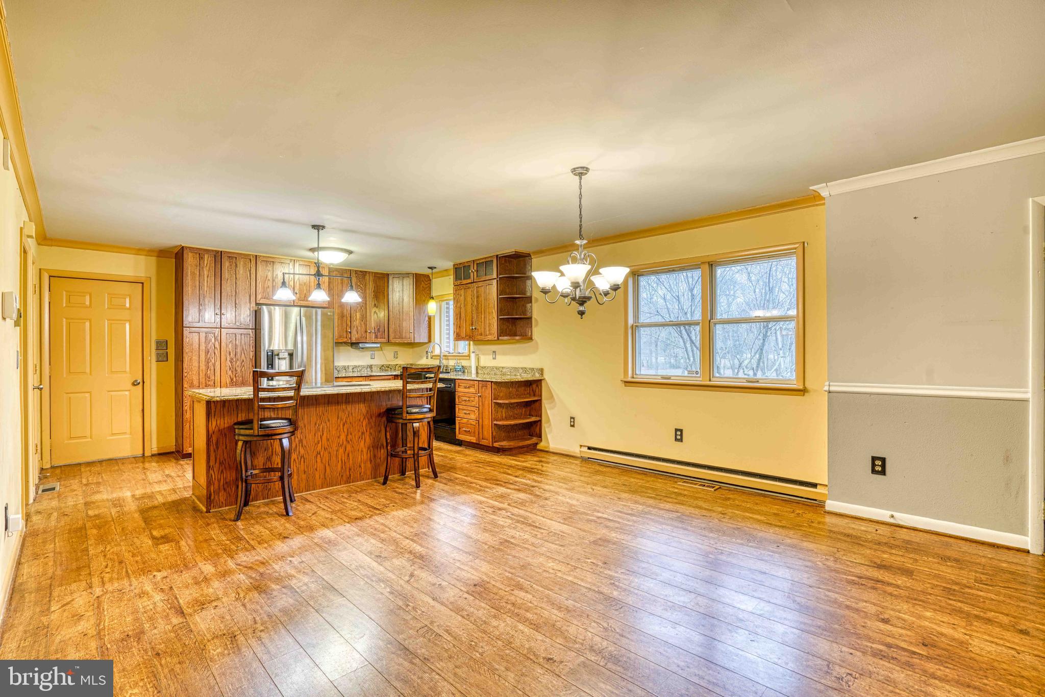 14957 Cherry Lane Ridgely, MD 21660 - Photo 14 of 66 a view of a kitchen with furniture and wooden floor