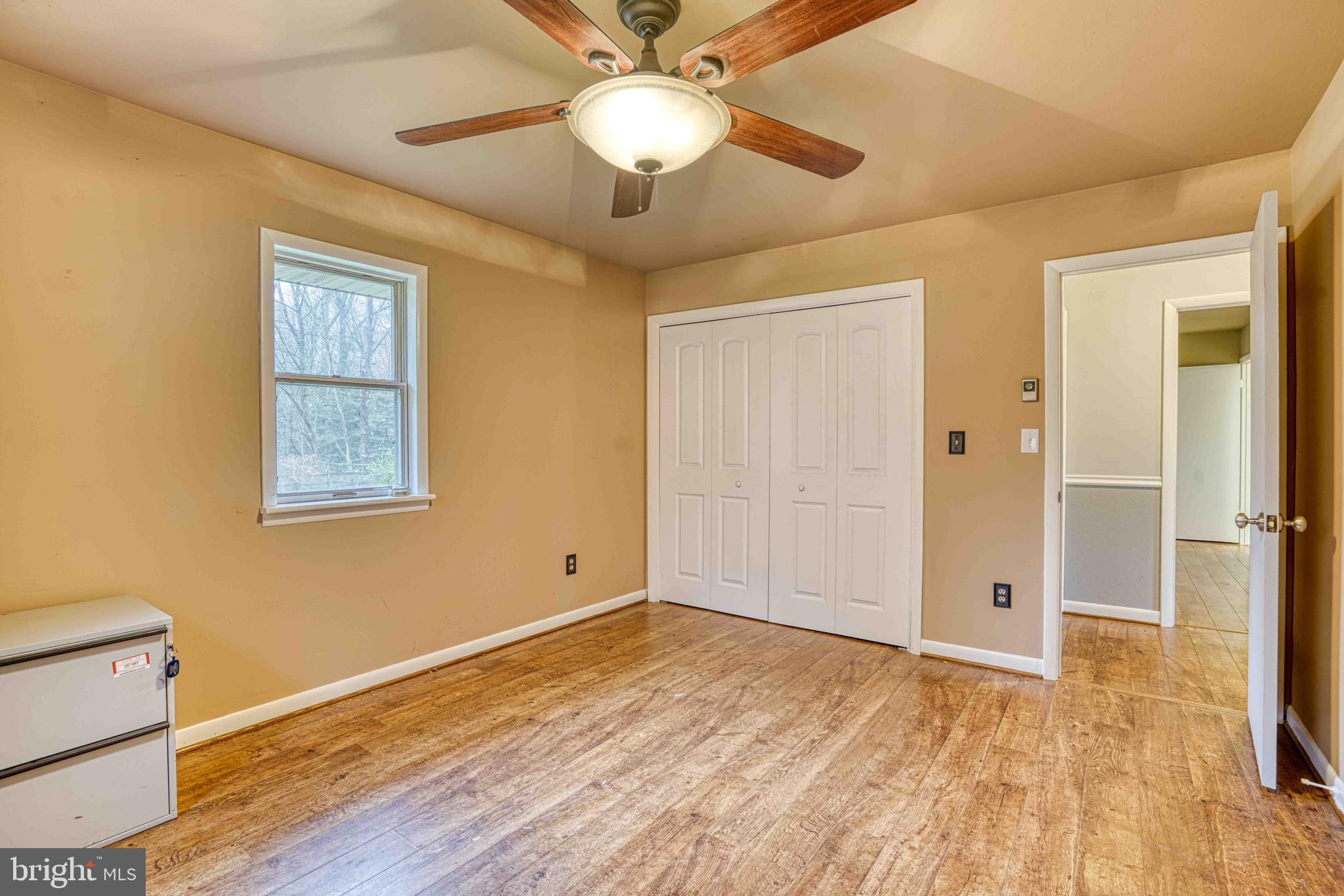 14957 Cherry Lane Ridgely, MD 21660 - Photo 29 of 66 a view of an empty room with wooden floor