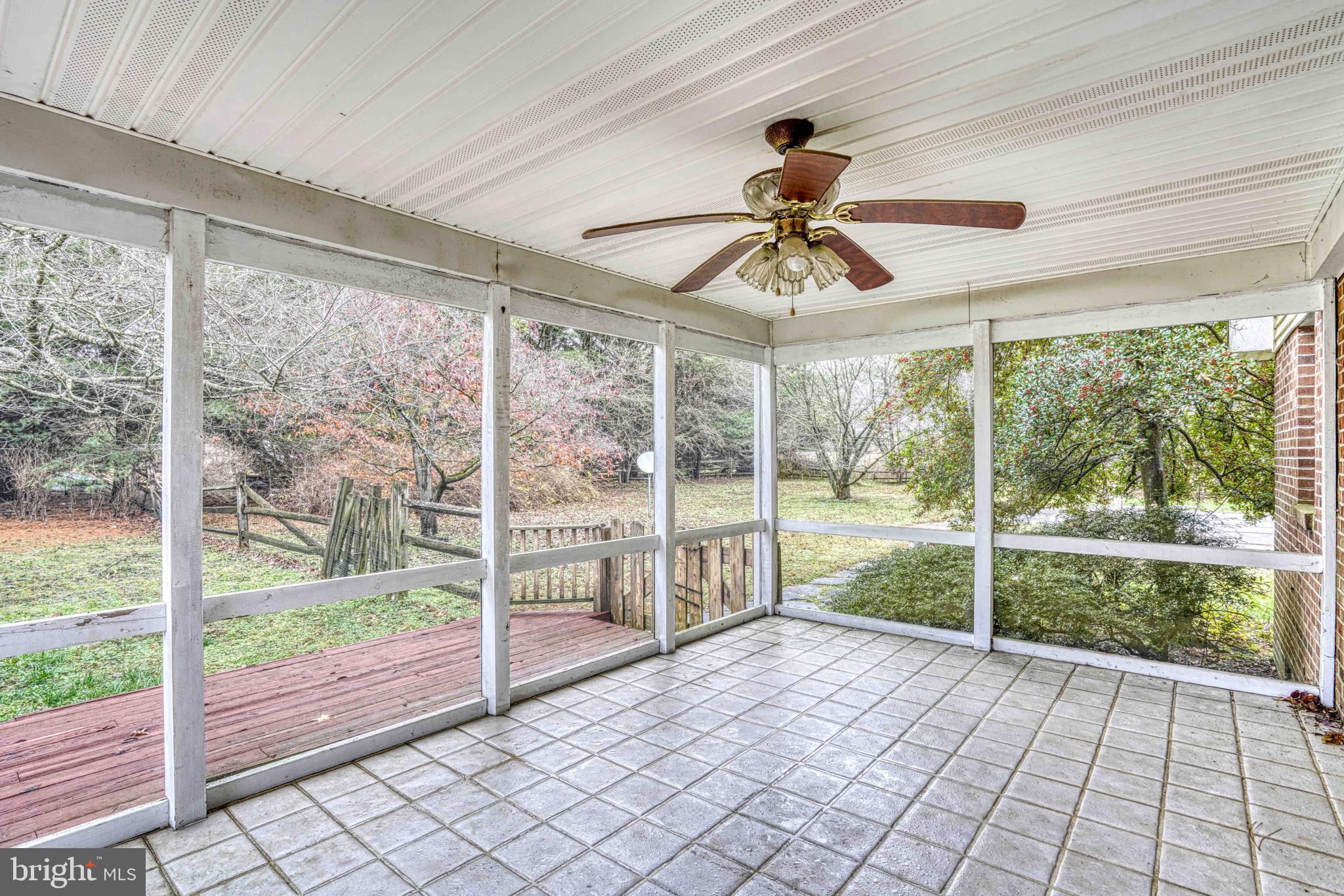 14957 Cherry Lane Ridgely, MD 21660 - Photo 35 of 66 a view of empty room with wooden floor and fan