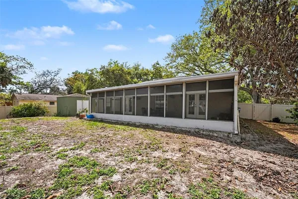 a house with trees in the background