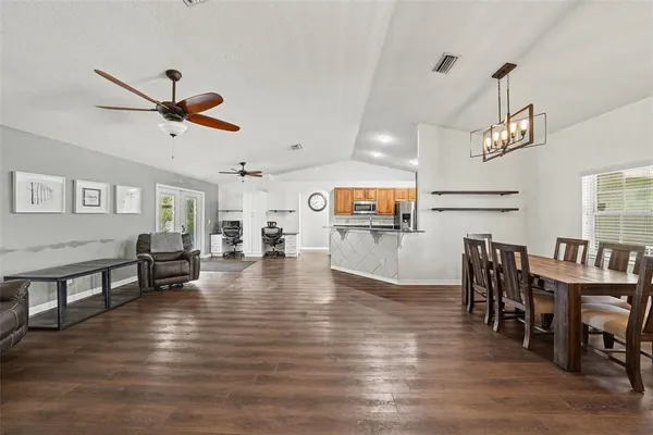 a view of a dining room with furniture window and wooden floor