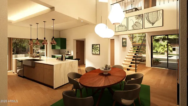 a living room with furniture a large window and stainless steel appliances