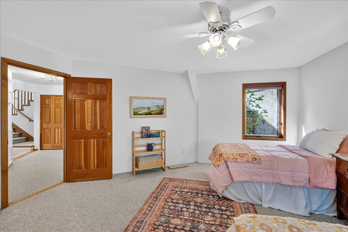 5224 Twin Falls Road Morgan Hill, CA 95037 - Photo 48 of 111 a bedroom with furniture and a chandelier fan