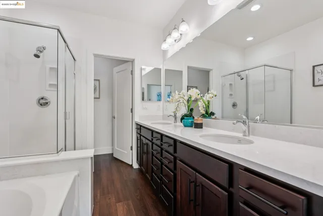 a bathroom with a bathtub and a shower