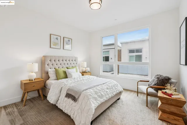 a bedroom with a bed and a couch